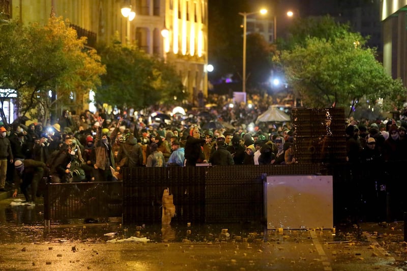 Lebanese protesters clash with riot police guarding a road leading to parliament in central Beirut amid ongoing anti-government demonstrations.  AFP