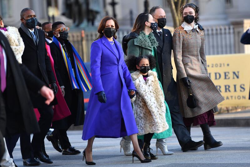 Vice President Kamala Harris wore a purple coat and dress by emerging black designers Christopher John Rogers and Sergio Hudson. AFP