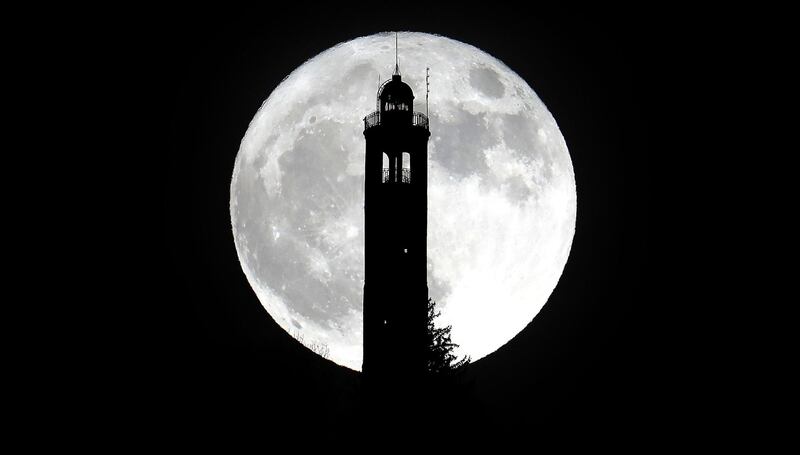 The super moon rises above the lighthouse of San Maurizio in Brunate, near Como (Milan), Italy. Matteo Bazzi / EPA