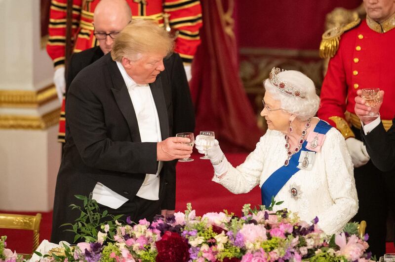 US President Donald Trump and Queen Elizabeth II make a toast during a State Banquet at Buckingham Palace in London, England. Getty Images