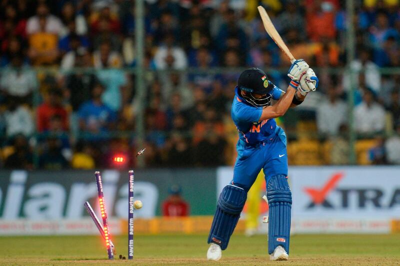 Virat Kohli is bowled out for 89. AFP