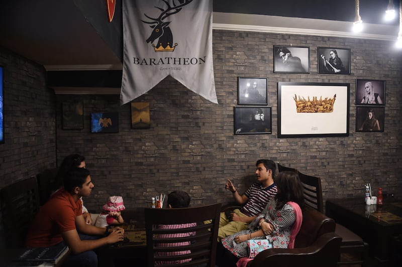 Customer Ali Abbas and his family visit the Game Of Thrones-themed restaurant named King's Landing in Islamabad. Farooq Naeem / AFP