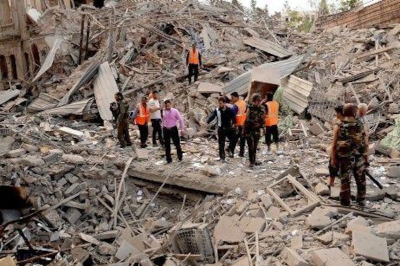 The aftermath of three car bomb explosions in Aleppo yesterday. At least 34 people died and more than 120 were injured, buildings were destroyed and survivors were trapped under rubble.