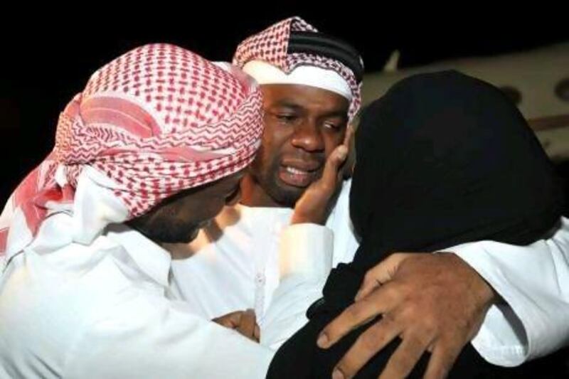 A tearful Mohammed Khamis Majed is greeted by his family as he arrives home last night after a 50-day kidnap ordeal in Nigeria.