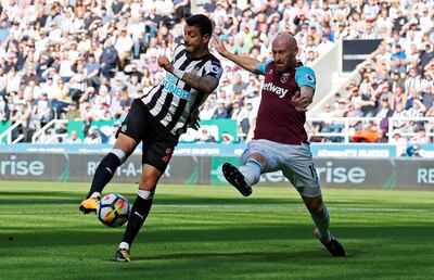 Football Soccer - Premier League - Newcastle United vs West Ham United - Newcastle, Britain - August 26, 2017   Newcastle United’s Joselu in action with West Ham United's James Collins    Action Images via Reuters/Craig Brough    EDITORIAL USE ONLY. No use with unauthorized audio, video, data, fixture lists, club/league logos or "live" services. Online in-match use limited to 45 images, no video emulation. No use in betting, games or single club/league/player publications. Please contact your account representative for further details.