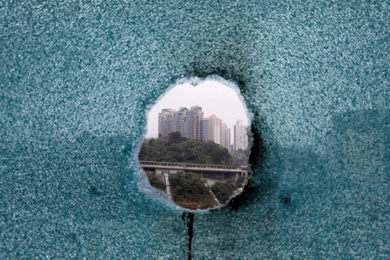 A shattered window is seen during an operation to evacuate the Hong Kong Polytechnic University. REUTERS