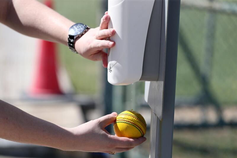 Dubai, United Arab Emirates - Reporter: N/A. News. Coronavirus/Covid-19. A man sanitises a cricket ball. Wednesday, October 14th, 2020. The Sevens, Dubai. Chris Whiteoak / The National