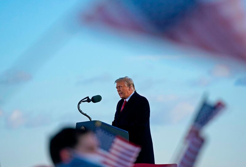 (FILES) In this file photo taken on January 20, 2021, utgoing US President Donald Trump addresses guests at Joint Base Andrews in Maryland.  Donald Trump will face an impeachment trial in the Senate over the ransacking of the US Capitol after the impeachment article against the former president is sent to the chamber on January 25, 2021, its Democratic leader Chuck Schumer announced. / AFP / ALEX EDELMAN
