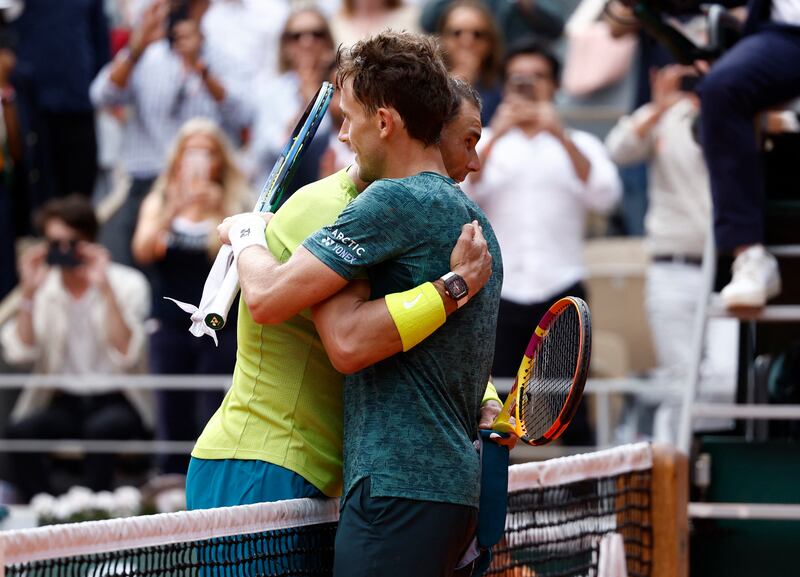 Rafael Nadal hugs Norway's Casper Ruud after winning the men's singles final. Reuters