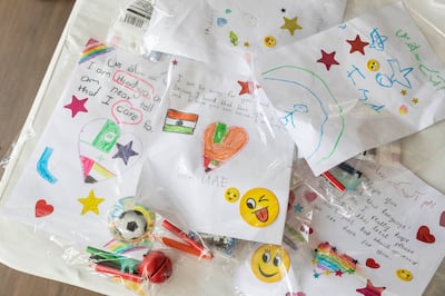 Drawings made by children in Dubai to be sent with special packages for flood victims in Pakistan. Antonie Robertson / The National 


