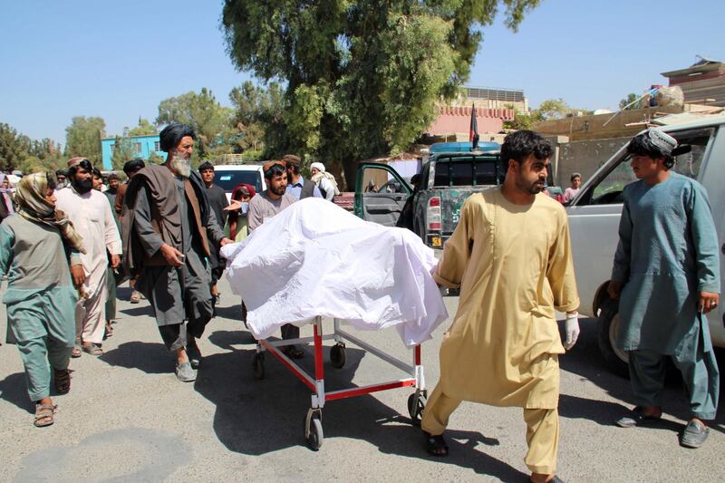 epa07863761 People shift the bodies of their relatives who were killed in an air raid and ground assault on a Taliban hideout by Afghan special forces, in Helmand, Afghanistan, 23 September 2019.  According to reports, dozens of civilians, part of a wedding procession, were killed when they came under fire during the operation targeting a house used by the Taliban in Musa Qala district that is under the control of militants.  EPA/WATAN YAR
