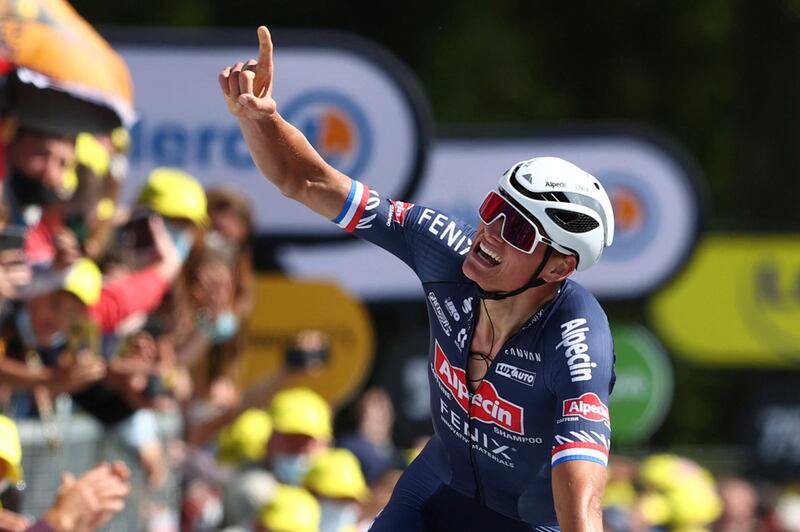 Mathieu Van Der Poel celebrates as he crosses the finish line to win the second stage of the Tour de France on Sunday, June 27, 2021. AP