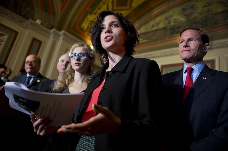 Members of the Russian protest group Pussy Riot and American politicians at a press conference in the US Capitol to discuss the Magnitsky Act, legislation intended to punish those responsible for the death in custody of Russian lawyer Sergei Magnitsky. Tom Williams / CQ Roll Call / Getty Images