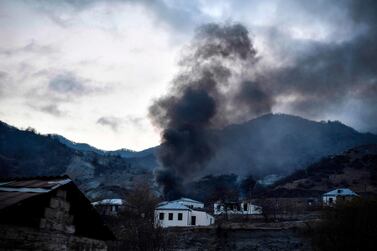 A house burns in a village outside the town of Kalbajar, on November 14, 2020, after a peace agreement was signed to end the military conflict between Armenia and Azerbaijan over the disputed Nagorno-Karabakh region. AFP