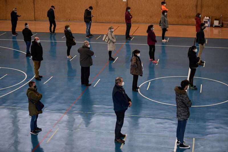 Residents wait in queues to get a rapid antigen test in Andosilla, northern Spain. AP Photo