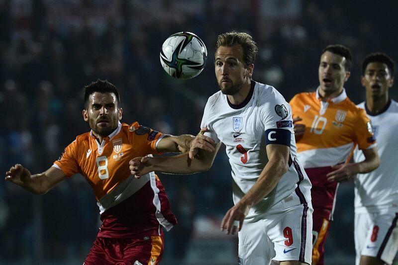 England forward Harry Kane and San Marino's midfielder Enrico Golinucci go for the ball. AFP