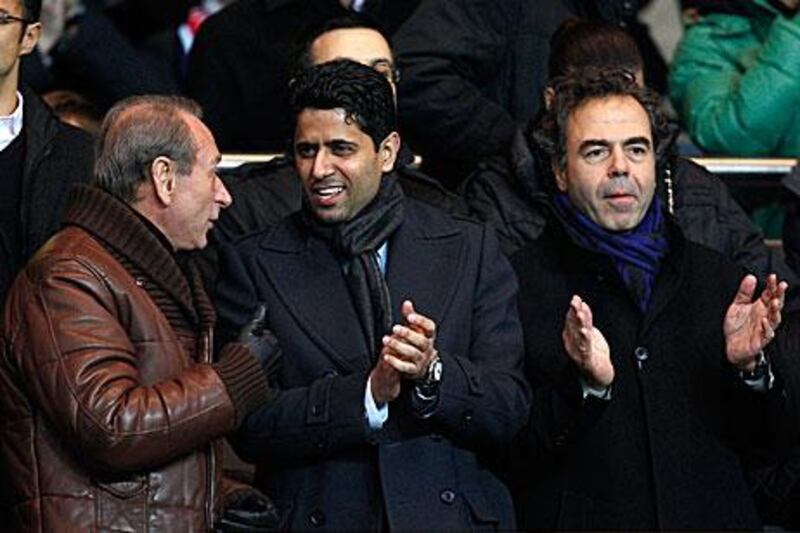 The Paris mayor Bertrand Delanoe, left, the owner of Paris St Germain and Al Jazeera Sports TV, Nasser Al Khelaifi, centre, and France’s education minister Luc Chatel at a PSG match in Paris  on Sunday.