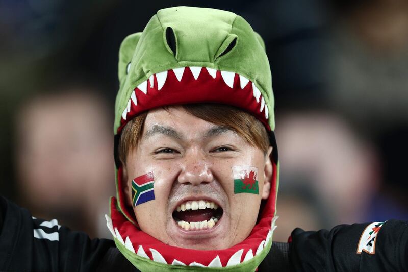 A fan awaits the start of the Japan 2019 Rugby World Cup semi-final match between Wales and South Africa at the International Stadium Yokohama in Yokohama.  AFP