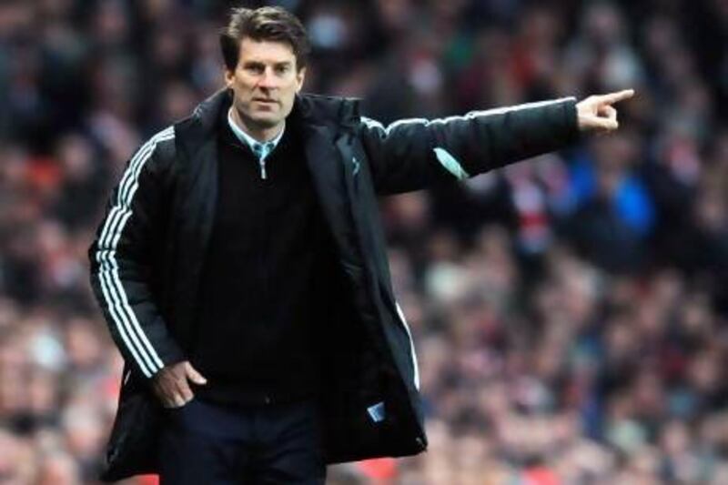 Swansea City's Danish manager Michael Laudrup gestures during the English Premier League football match between Arsenal and Swansea City at the Emirates Stadium in north London on December 1, 2012. Swansea won 2-0. AFP PHOTO / OLLY GREENWOOD