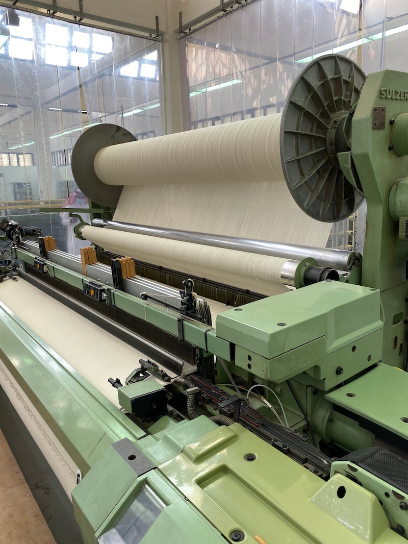 The machine produces cotton textiles in two kinds. The first will be used in the inner lining of the kiswah, and the other, which is white, is used to cover the Kaaba during the Hajj season when the kiswah is pulled up.