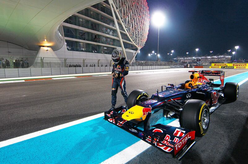 ABU DHABI, UNITED ARAB EMIRATES - NOVEMBER 03:  Sebastian Vettel of Germany and Red Bull Racing stands next to his car on the track after qualifying for the Abu Dhabi Formula One Grand Prix at the Yas Marina Circuit on November 3, 2012 in Abu Dhabi, United Arab Emirates.  (Photo by Vladimir Rys/Getty Images) *** Local Caption ***  155345671.jpg
