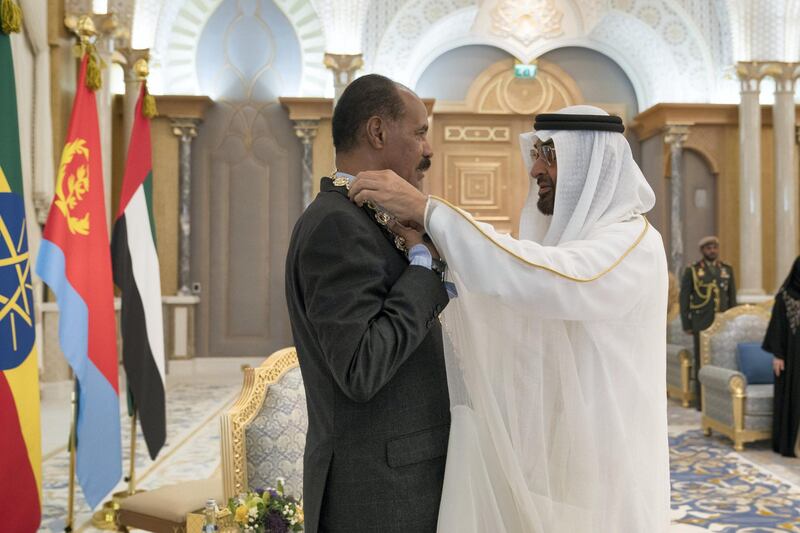 ABU DHABI, UNITED ARAB EMIRATES - July 24, 2018: HH Sheikh Mohamed bin Zayed Al Nahyan Crown Prince of Abu Dhabi Deputy Supreme Commander of the UAE Armed Forces (R), presents a Zayed Medal to HE Isaias Afwerki, President of Eritrea (L), during a reception at the Presidential Palace. 

( Mohamed Al Hammadi / Crown Prince Court - Abu Dhabi )
---
