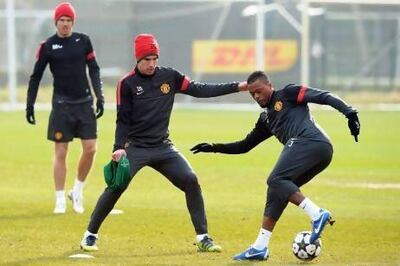 Robin van Persie said Manchester United players would push each other on in training. EPA