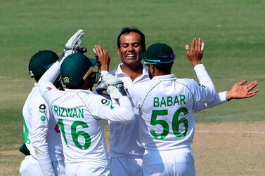 Pakistan's Nauman Ali (2R) celebrates with teammates after taking the wicket of South Africa's Anrich Nortje (not pictured) during the fourth day of the first cricket Test match between Pakistan and South Africa at the National Stadium in Karachi on January 29, 2021. / AFP / Asif HASSAN