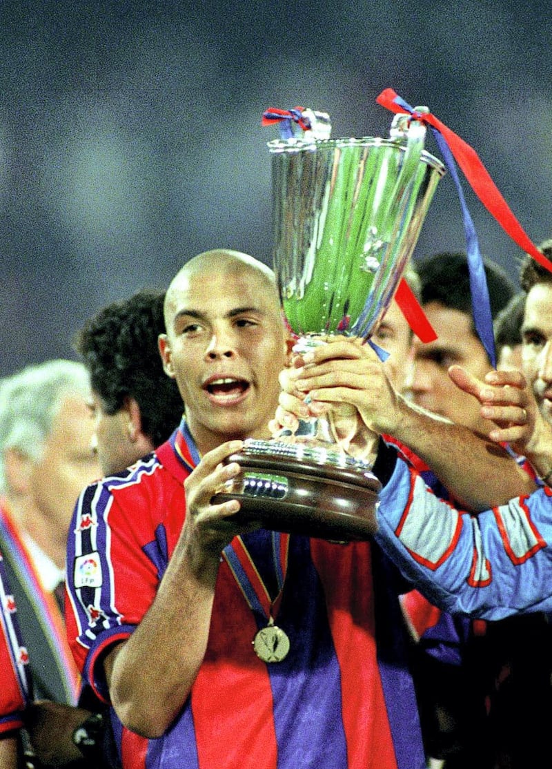 ROTTERDAM 14 MAY 1997: Ronaldo celebrates with the trophy at the end of the UEFA Cup Winners' Cup Final match between Barcelona and PSG played at Feijenoord Stadion in Rotterdam, Netherlands.