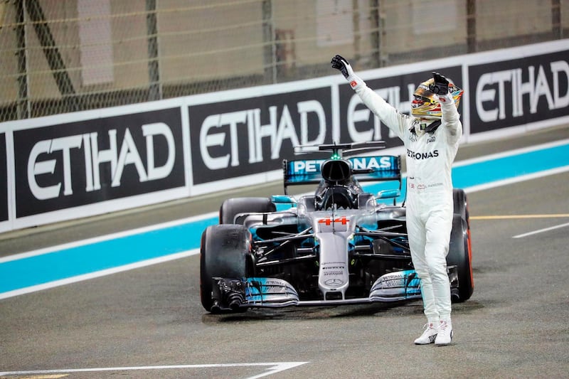 epa06352350 British Formula One driver Lewis Hamilton of Mercedes AMG GP celebrates after taking the second place in the 2017 Formula One Grand Prix of Abu Dhabi at Yas Marina Circuit in Abu Dhabi, United Arab Emirates, 26 November 2017. Hamilton took the Formula One World Championship title.  EPA/VALDRIN XHEMAJ