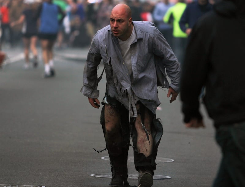 In this photo provided by The Daily Free Press and Kenshin Okubo, people react to an explosion at the 2013 Boston Marathon in Boston, Monday, April 15, 2013. Two explosions shattered the euphoria of the Boston Marathon finish line on Monday, sending authorities out on the course to carry off the injured while the stragglers were rerouted away from the smoking site of the blasts. (AP Photo/The Daily Free Press, Kenshin Okubo) MANDATORY CREDIT *** Local Caption ***  Boston Marathon Explosions.JPEG-0c378.jpg