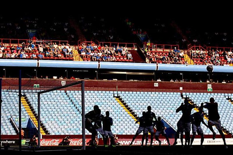 The lack of Wigan Athletic fans at Villa Park allows Aston Villa and Wigan Athletic players to create nice silhouettes during Villa's 2-0 win.

Scott Heavey / Getty Images