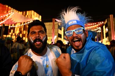 DOHA, QATAR - NOVEMBER 19: Football fans gather at the Lusail Boulevard fan area ahead of the FIFA World Cup Qatar 2022 at  on November 19, 2022 in Doha, Qatar. (Photo by Clive Mason / Getty Images)