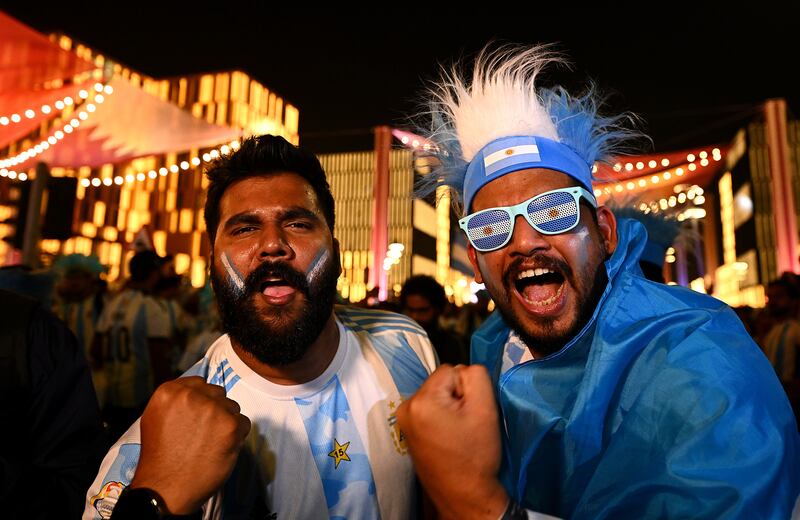 Football fans in Argentina colours at the Lusail Boulevard fan area. Getty