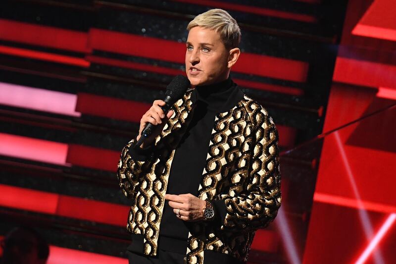 (FILES) In this file photo taken on January 26, 2020 US comedian Ellen DeGeneres introduces Lil Nas X and Billy Ray Cyrus during the 62nd Annual Grammy Awardsin Los Angeles.  Ellen DeGeneres opened the 18th season of her talk show September 21, 2020 by addressing allegations of toxic workplace culture under her watch, saying "I take responsibility for what happens at my show." / AFP / Robyn Beck
