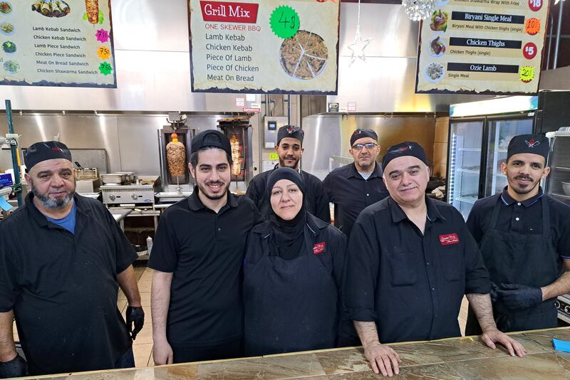 Abdullatif Dalati, second right, and his family have helped to build a new community in Kentucky. Photo: Stephen Starr