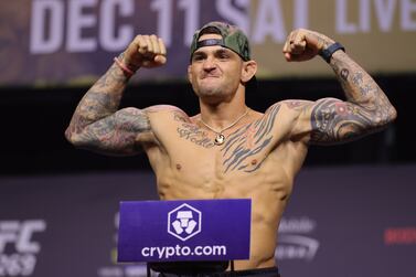 LAS VEGAS, NEVADA - DECEMBER 10: Dustin Poirier poses on the scale during the UFC 269 ceremonial weigh-in at MGM Grand Garden Arena on December 10, 2021 in Las Vegas, Nevada.    Carmen Mandato / Getty Images / AFP
