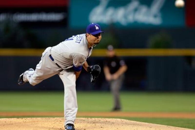 Josh Beckett pitches during his debut for the Los Angeles Dodgers
