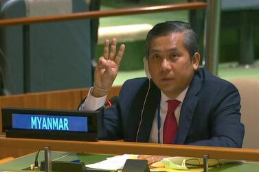Myanmar's ambassador to the United Nations Kyaw Moe Tun holds up three fingers at the end of his speech to the UN.