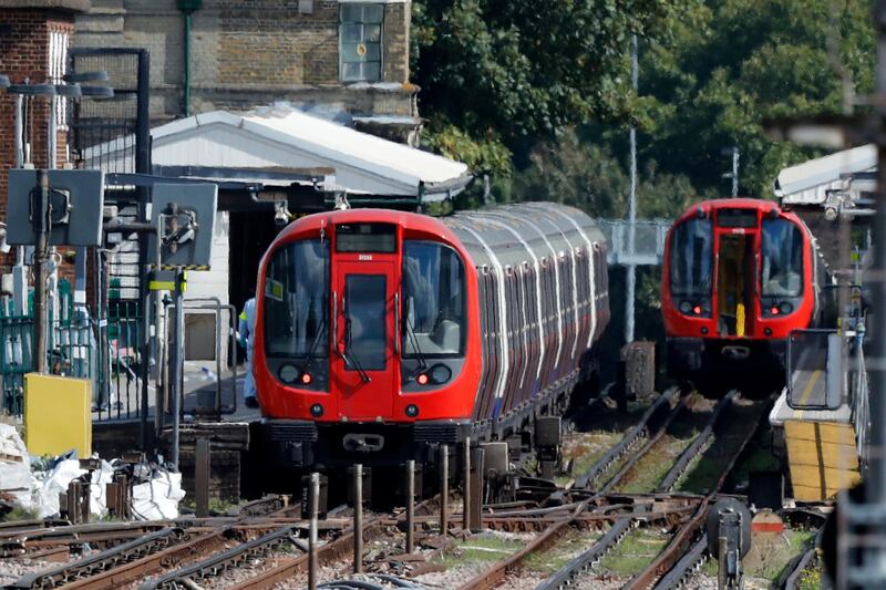 FILE - This is a Friday, Sept. 15, 2017 file photo of a police forensic officer walks beside the train where an incident happened, that police say they are investigating as a terrorist attack, at Parsons Green subway station in London. London's police chief Cessida Dick said Friday Sept 22, 2017 that the bomb that failed to detonate last week in a London subway car at Parsons Green was loaded with explosives and shrapnel. (AP Photo/Frank Augstein/File)