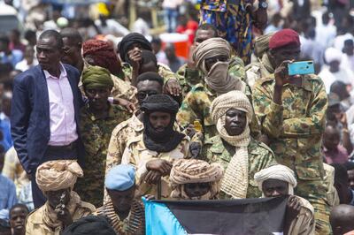 Members of Sudan Liberation Movement attend the ceremony held after former leader of Sudan Liberation Movement Mini Arko Minawi (not seen) was appointed as the new Governor of Darfur in the capital city Al Fashir, Darfur, Sudan on August 10, 2021. Anadolu Agency