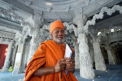 Swami Akshaymunidas, one of the main designers of the place of worship, poses for a photo under the dome of the stone-built Hindu temple. AP