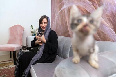 DUBAI, UNITED ARAB EMIRATES. 09 October 2017. Dr Manal Al Mansoori, animal rights activist, Director of Yanni Animal Welfare Group at home with three rescued kittens. (Photo: Antonie Robertson/The National) Journalist: Haneen Dajani. Section: National.