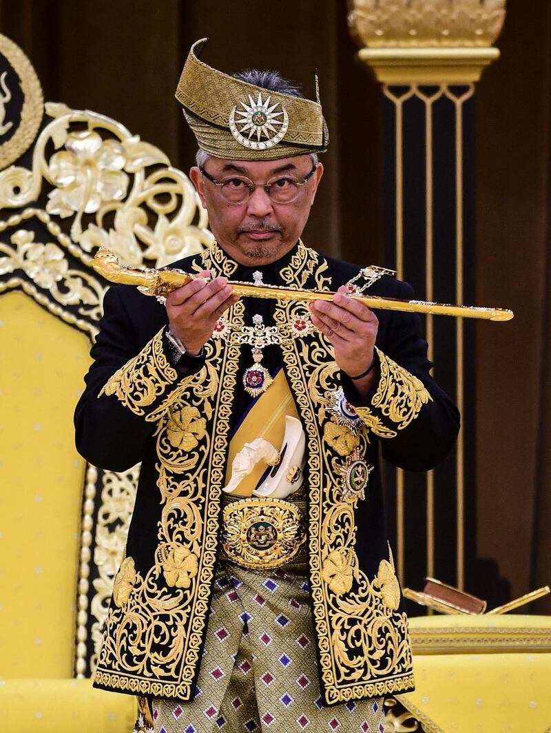 King Abdullah , holding a keris, a traditional Malay dagger, on the throne during his coronation at the National Palace in Kuala Lumpur. EPA