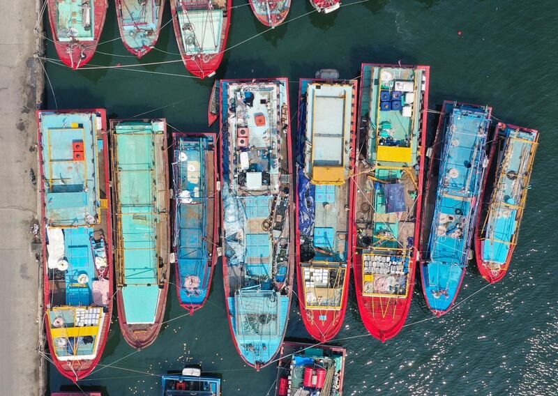A picture taken with a drone shows fishing boats park at Muara Baru fishing port in Jakarta, Indonesia.  EPA
