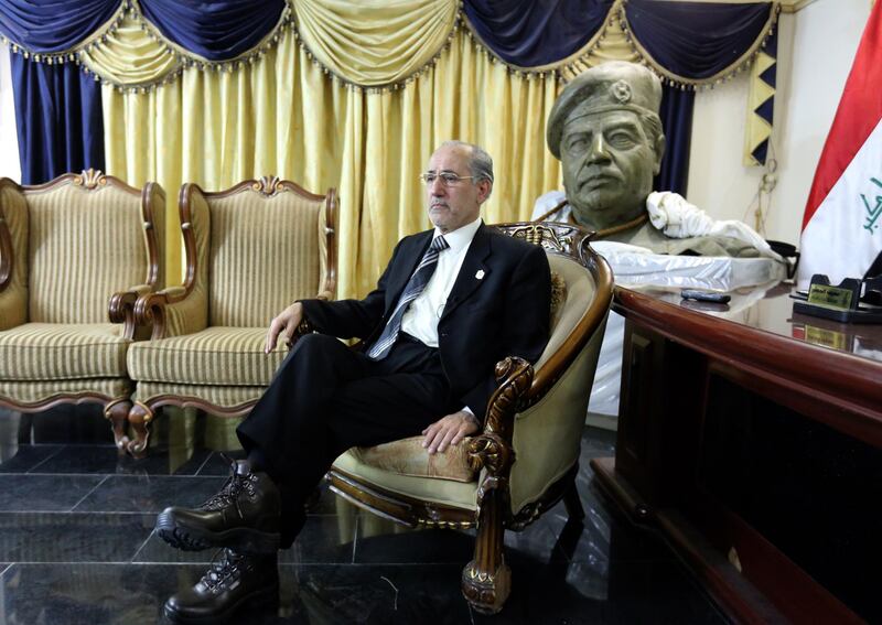 TO GO WITH AFP STORY BY MOHAMAD ALI HARISSI 
The bust of former Iraqi leader Saddam Hussein and the actual rope used to hang him, are on display in the living room of former national security adviser Mowaffak al-Rubaie, seen during an interview with the AFP where he gave details of his execution, on December 23, 2013. Saddam was executed by hanging in Iraq in the early hours of December 30, 2006, in Baghdad after he was captured by US military forces hidding in an underground hole at a farm in the village of ad-Dawr, near his hometown of Tikrit in northern Iraq on December 13, 2003  AFP PHOTO/SABAH ARAR (Photo by SABAH ARAR / AFP)