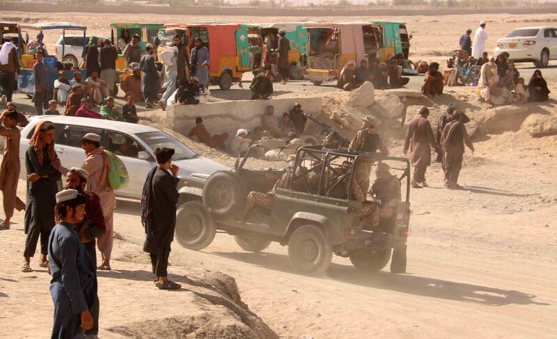 People stranded at a crossing on the Pakistan-Afghanistan border near Spin Boldak wait for it to reopen after it was closed by the Taliban. EPA