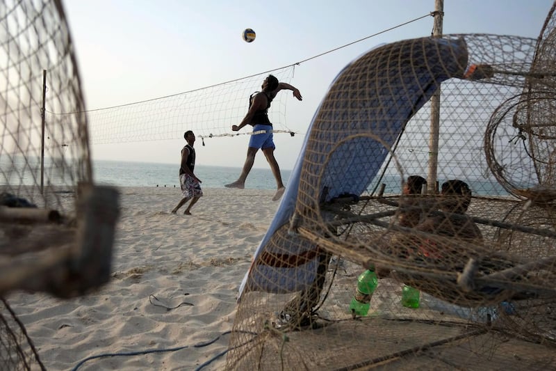 DUBAI, UNITED ARAB EMIRATES,  July 20, 2012. Indian fisherman play beach volley ball with a home made net on Jumeirah beach in the afternoon of the first day of Ramadan. FOCAL POINT (ANTONIE ROBERTSON / The National)