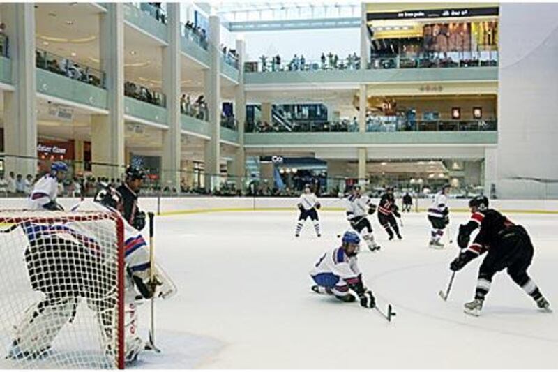 Players from the Abu Dhabi Scorpions, Al Ain Vipers and Dubai Mighty Camels play the <i>USS Ronald Reagan</i> ice hockey team at Dubai Mall on Tuesday.