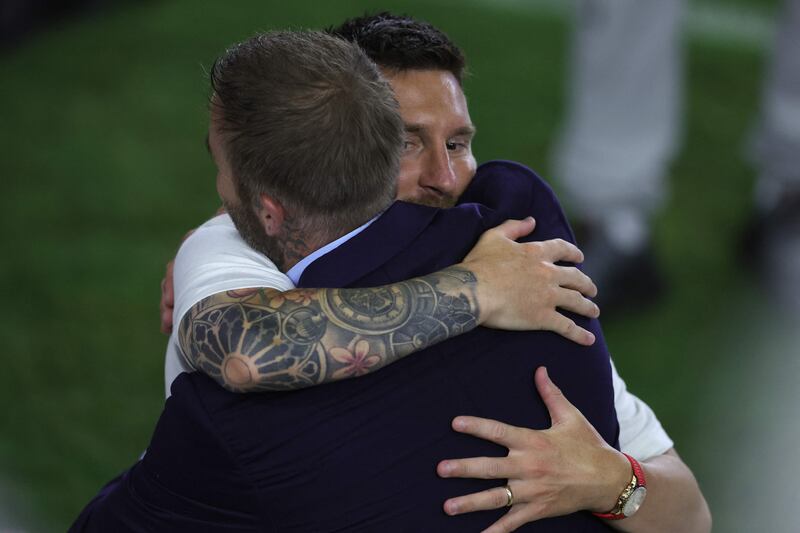 Lionel Messi hugs Inter Miami co-owner David Beckham. AFP